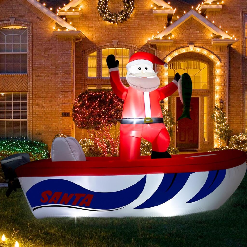 Inflatable yard decoration featuring Santa Claus on a fishing boat. A home decorated with holiday lights is in the background.